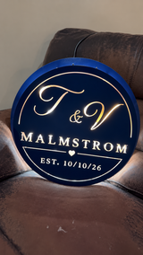 Custom backlit wedding monogram sign in navy blue, full front view