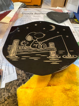 Snoopy and Woodstock fishing metal plaque after engraving in the shop