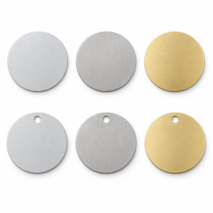 Design render — bare aluminum, stainless steel and brass round blanks; no-hole and single-hole examples. Not manufactured stock.