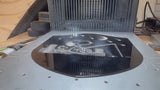 Laser engraving the Snoopy and Woodstock fishing metal plaque